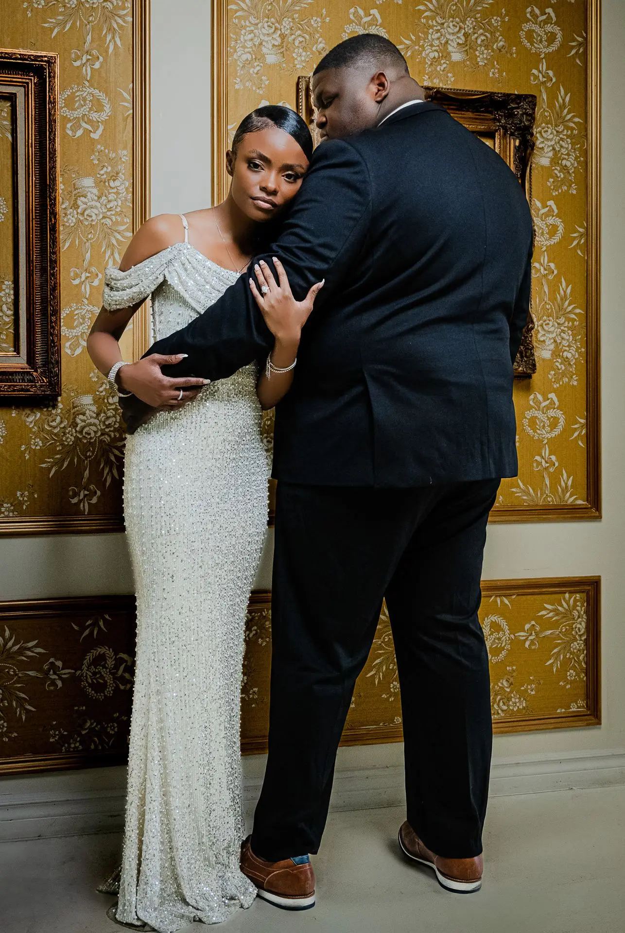 	Bride and groom walking hand in hand – elegant fine art wedding photo